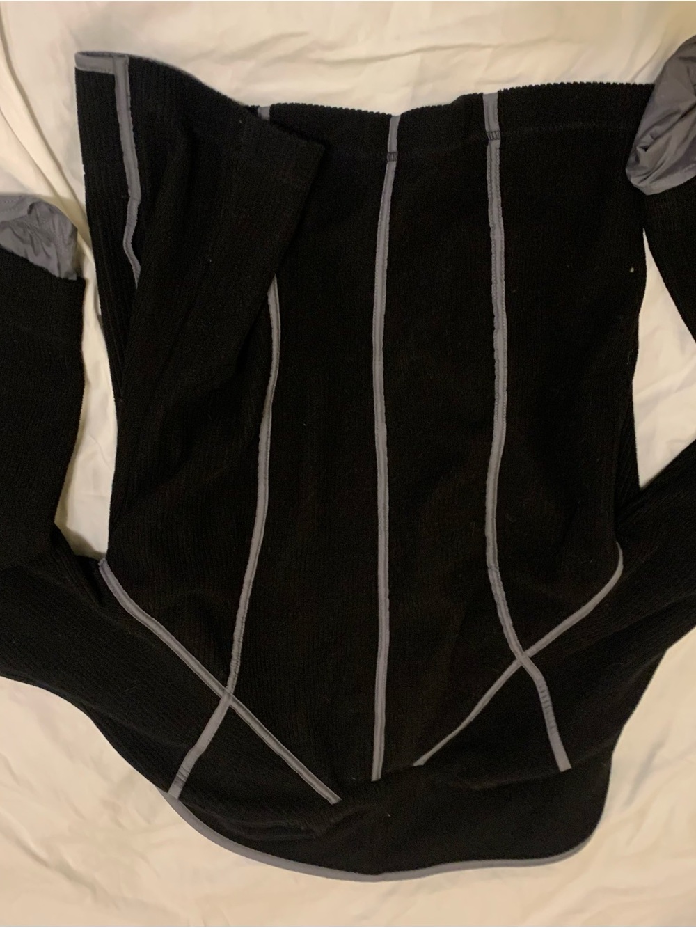 SPANNER Black Knit Top with Subtle Gray Tag Detail